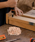 Person using tool on wood with 100 Pieces M8x30mm Wooden Dowels For Woodworking Furniture With Stable Grip And No Wobble visible nearby