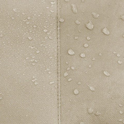 Close-up of water-repellent fabric on round patio table and chair set cover showing all-weather protection.