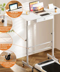 Compact Adjustable Standing Desk On Wheels For Home Office with iPad slot, 32 inch top and white frame, positioned beside a treadmill