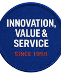 Blue round patch with text 'Innovation, Value & Service Since 1958' in white and red letters.