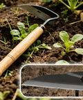 Japanese Garden Hand Hoe Sickle For Right Handed Use High Carbon Steel Blade lying on soil near plants