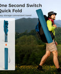 Hiker carrying Two Pack Folding Camp Chairs With Built In Four Can Cooler, lightweight collapsible bag in scenic outdoors.