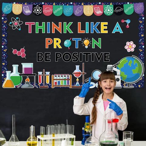 Girl in lab coat posing with 56Pcs Science Bulletin Board Decorations Set With Lab Themed Cutouts, Chalkboard decor background.