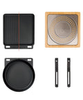 Top view of Pi Cast Iron Three Piece Cookware Set with round skillet, reversible grill griddle, removable handles, bamboo base