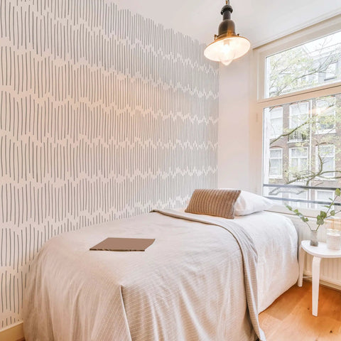 Bedroom accent wall with DIY Friendly Ink Lines Geometric Wall Stencil Set 2 Pack 17x39 Inches for easy stencil design.