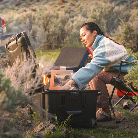 Trail 80 Waterproof Storage Box With Wheels, 79L Outdoor Gear Case For Camping, shown being used at a campsite