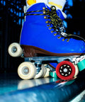 Blue quad skate on ramp with Red 92A PU Roller Skate Replacement Wheel for Quad and Inline Skates Indoor Use Smooth Stable Ride.