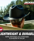 Man wearing Cowboy Style Nonvented Full Brim Hard Hat With 4 Point Ratchet Suspension ANSI Z89.1 Type 1 Class E