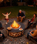Group enjoying a campfire with a 40-Inch Compact Fire Pit Surround Tabletop For Solo Stove Ranger And Tiki 20-Inch Pits, snacks on top.