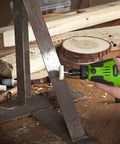 Straight Up Powerhouse 12V Cordless Rotary Tool With Keyless Chuck And Flex Shaft in use for metal polishing on a workshop surface.