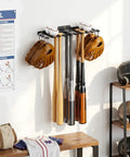 Beast Wall Mounted Home Gym Rack with baseball bats, gloves, and balls organized neatly on a wall, showcasing storage capacity.