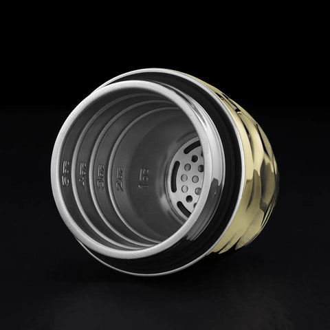 Interior view of the Vibes On Point 25 Oz Gold Vacuum Insulated Cocktail Shaker with strainer and measuring markings.