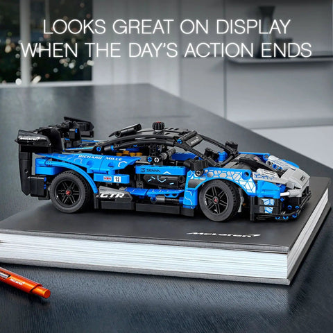 Technic McLaren Senna GTR 42123 racing collectible model car build kit sleek display on black book, detailed V8 engine view