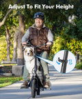 Man riding C1 Plus Electric Scooter for Adults with Seat and Pet Basket on city sidewalk with trees in background