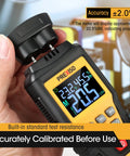 Close-up view of 7 In 1 Digital Wood Moisture Meter For Firewood And Woodworking Pin Type Tester held in hand, displaying readings.