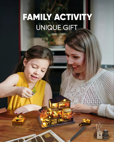 Mother and daughter assembling Beginner Friendly Mini Dollhouse Kit With Japanese Garden House Theme on a table.
