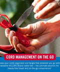 Hands using 100 Pack 6 Inch Reusable Cable Ties For Electronics And Desk Organization Black A Handy Gift For Tech Dudes Who Crave Tidy Cords And Quick Cable Management to organize red USB cable