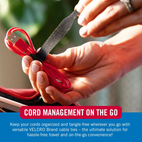 Hands using 100 Pack 6 Inch Reusable Cable Ties For Electronics And Desk Organization Black A Handy Gift For Tech Dudes Who Crave Tidy Cords And Quick Cable Management to organize red USB cable