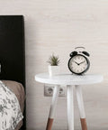 Bedroom with white wood grain peel and stick wallpaper for cabinets and drawers, self-adhesive liner on wall behind nightstand.