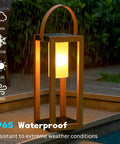 Rustic Solar Lantern For Outdoor Use With Portable Handle, Waterproof All-Weather Steel Yard Light in the rain.
