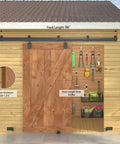 8Ft Black Exterior Barn Door Hardware Kit with sliding rail track mounted above wooden shed, includes five brackets