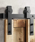 Kick Back And Watch These Doors Glide Like Butter With Our Solid 4 Ft Black Sliding Door Hardware Kit Featuring J Shape Rail And Heavy Duty Nylon Rollers For Zero Hassle Barn Door Projects, close-up of track and rollers.