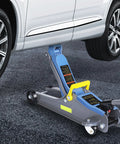 2.5 Ton Heavy Duty Hydraulic Floor Jack With Low Profile Design lifting a car, blue gray jack with reflective tape