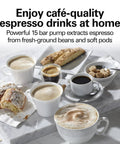 15 Bar Espresso Machine For Sippin Straight Up Lattes And Creamy Cappuccinos With Dual Auto Frother Brews Two Cups At Once Compatible With Pods Or Grounds 50 Oz Tank Black with cappuccinos and pastries on marble surface.