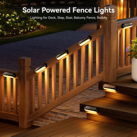 4 Pack Solar Outdoor Lights with RGB Color Changing and Warm White Modes on wooden deck railing at night.