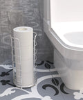 Free Standing Toilet Paper Holder Stand In Brushed Nickel Stainless Steel, Holds 3 To 4 Rolls, beside toilet on patterned floor
