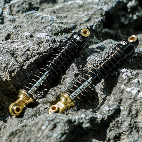 59mm Threaded Oil Shocks With Brass Ends For 1/18 TRX4M Upgrade on rocky terrain