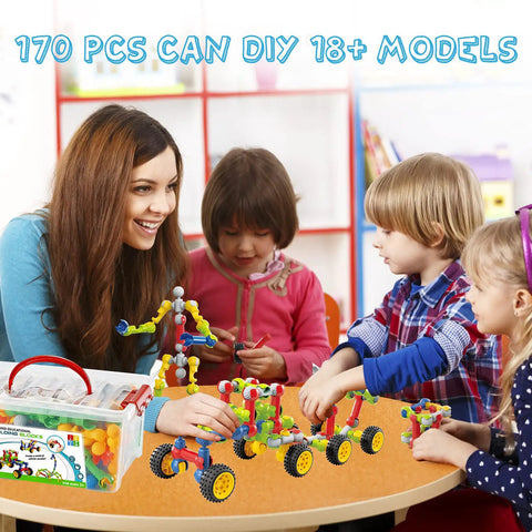 Children playing with Epic 170 Piece Building Set For Kids Ages 3 To 9 With Toy Box Storage And Idea Guide at a table.