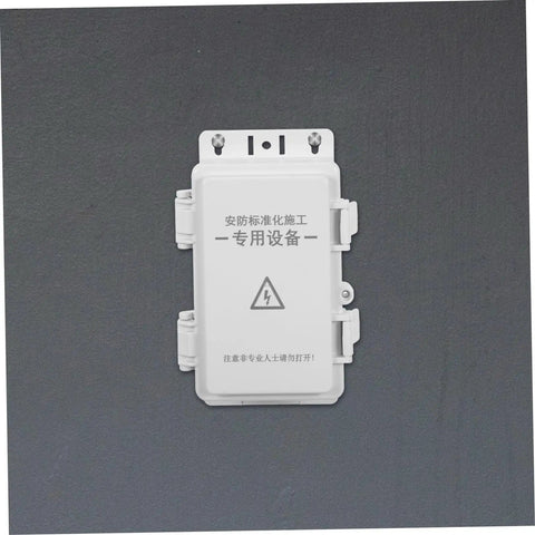 Heavy Duty White Waterproof Plastic Electrical Junction Box For Wiring Security Cameras And Electronic Components With UV Resistance For Outdoor Commercial Use mounted on a dark surface.