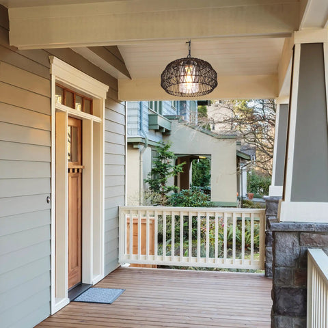 1 Light Outdoor Indoor Plug In Pendant Light With Black Woven Fabric Shade hanging on a porch, creating a cozy patio vibe.