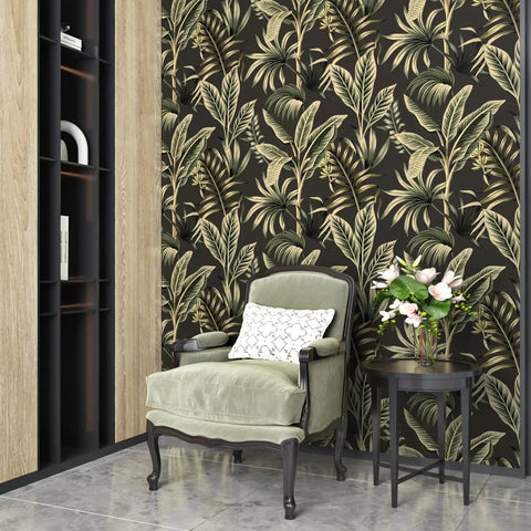 Room with tropical floral peel and stick wallpaper featuring palm leaves, luxury armchair, and side table for decor.