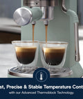 Compact Espresso Machine And Cold Brew Coffee Maker With Adjustable Milk Frother Wand For Smooth Hot Iced Lattes And Bold Cappuccinos brewing espresso into double glass cups.