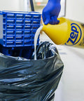 Heavy Duty Wet Look Floor Polish Bringing That Sleek High Gloss Shine And Solid Non Slip Shield For Busy Retail Spots And School Lobbies Keeps Flooring Looking Fresh Legit Tough While This Heavy Duty Gallon is being poured into a mop bucket.