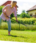 Woman using Multi Functional Manure Fork For Mulching And Garden Cleanup No Fuss Heavy Duty Handheld Grass Fork for yard work