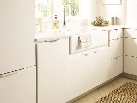 Aloft Satin Nickel Cabinet Edge Pull 4 And Nine Sixteenths Inch Center To Center Drawer Handle Aluminum Hardware installed in kitchen