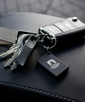Proximity Security Tag 2.0 Bluetooth Add On For CarLock System That Powers Up Proximity Alerts Based On How Close You Are Energy Saving Auto Security Long Lasting Battery Up To 1 Year Requires CarLock Main Unit Not Standalone, black keychain tag with car keys