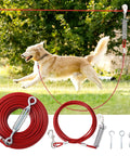 Heavy Duty 200 Ft Dog Runner With 10 Ft Tie Out Cable For Big Dogs Up To 250 Lbs Safe Zip Line For Backyard Park And Camping Use Red Vinyl Coated Stainless Steel showing installed in a park.