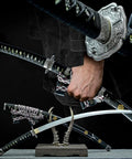 Hand holding 41 Inch Black Authentic Tachi Style Curved Handmade Japanese Samurai Katana Sword With T10 Carbon Steel Full Tang