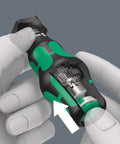 Hands holding Kraftform Kompakt Turbo 19-Piece Screwdriver Set with visible internal mechanical turbo boost and push button