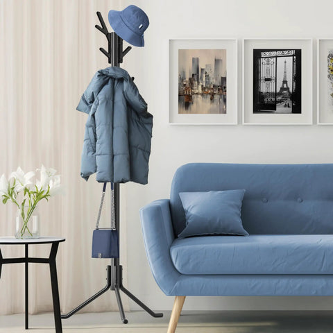 Tree Shaped Coat And Hat Organizer Rack With Eighteen Hooks For Entryway Or Bedroom Dope Space Saving Stand To Hang Coats Hats Scarves And Bags In Black Finish beside a blue sofa.