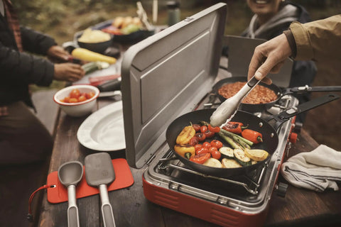Outdoor Camp Stove Cooking Set With Silicone Utensil Rest Silicone Turner Silicone Spoon And 10.5 Inch Stainless Steel Tongs in use