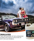 Heavy Duty Ultrasonic Carburetor Cleaning Solution One Gallon Sonic Bath Fluid displayed with a classic car and couple.