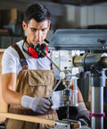 Worker using drill wearing General Purpose Nitrile Coated Work Gloves With Micro Foam Nitrile Grip, large size, in workshop