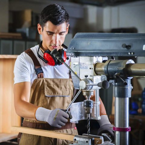 Worker using drill wearing General Purpose Nitrile Coated Work Gloves With Micro Foam Nitrile Grip, large size, in workshop