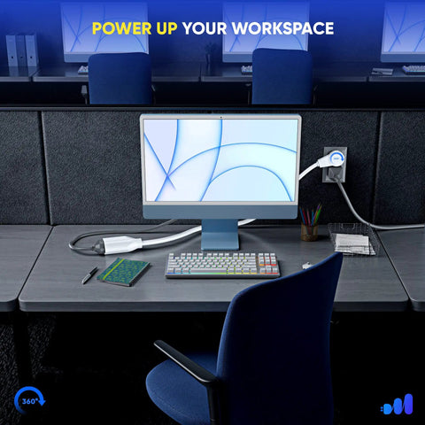 3 Foot White Extension Cord With 360 Degree Rotating Flat Plug connected to desk outlet, powering a computer