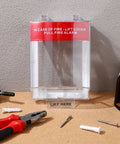 Straight Up Tough Fire Alarm Pull Station Cover with red warning label, clear plastic, installed with tools on table.